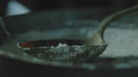 Spoon on a dish of white powder Stock Footage 275507037
