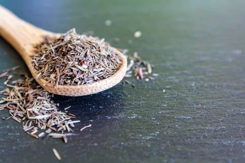 Spoon with dried thyme Stock Photos