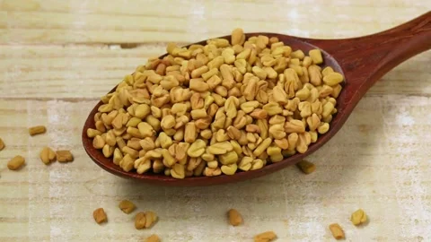 Spoon with fenugreek seeds close up Stock Footage 172141441