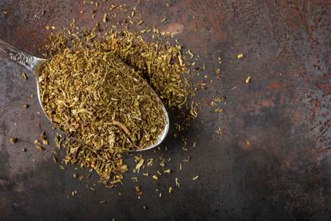 Spoon filled with dried thyme Foto stock