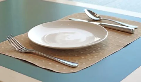 Spoon fork  knife and empty white plate Stock Photos