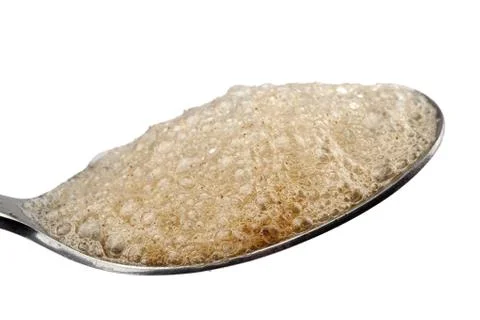 Spoon full of brown bubbles Stock Photos