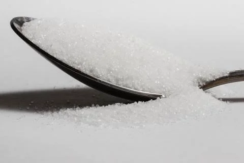 Spoon full of sugar side Stock Photos