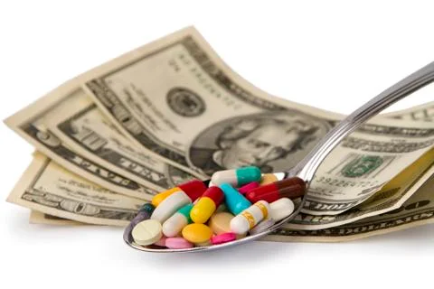 Spoon full of tablets Stock Photos