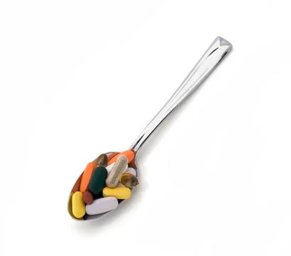 Spoon full of vitamins Stock Photos