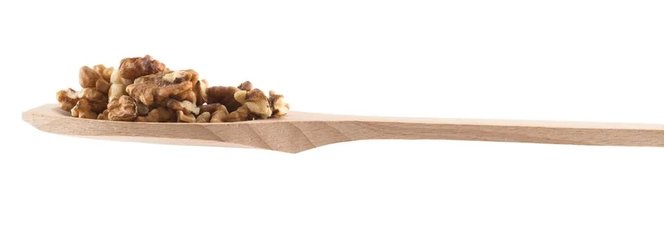 Spoon full of walnuts isolated Stock Photos