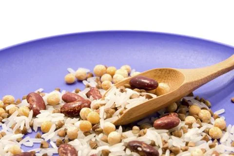 Spoon with grain on the plate Stock Photos