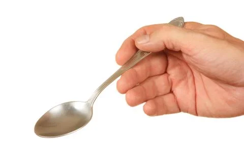 Spoon in hand Stock Photos
