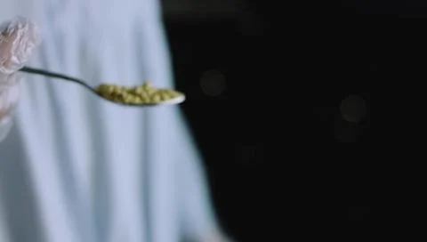Spoon Holding a Measured Portion of Ground Baking Spice Stock Photos