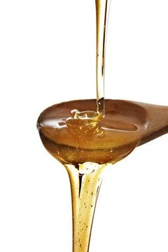 .Spoon of honey Stock Photos