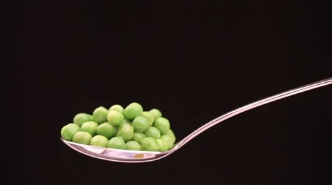 Spoon with hot peas from which emits smoke Stock Footage 43842063