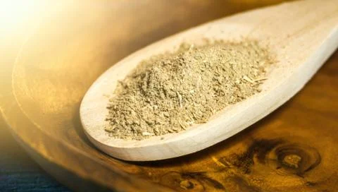 Spoon with Kava Kava root powder in wooden cup Stock Photos