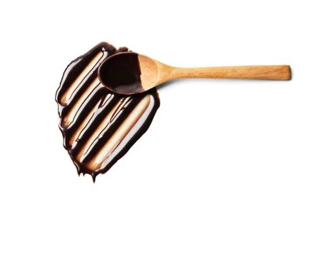 Spoon with liquid chocolate Stock Photos