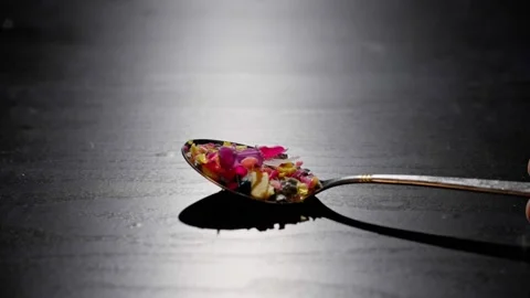 Spoon of Microplastic under Dramatic Lighting Vídeo Stock 297196313