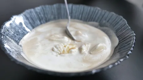 Spoon is mixed with ice cream Stock Footage 88100670