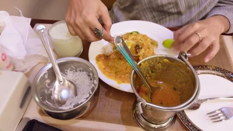Spoon moves through pulses and white rice for eating Stock Footage 302633677