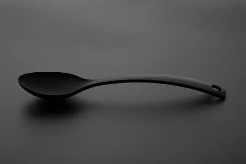 Spoon over gray background Stock Photos