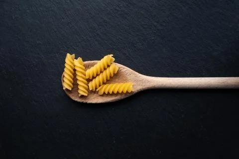 Spoon with pasta Stock Photos