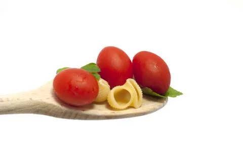 Spoon pasta with vegetables and cherry tomatoes Stock Photos