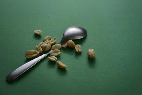 Spoon with peanuts on dark table studio still life photo Stock Photos