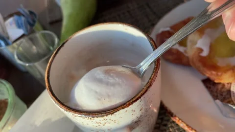 Spoon picking foam on the latte Stock Footage 235328831