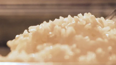 Spoon picking up rice Stock Footage