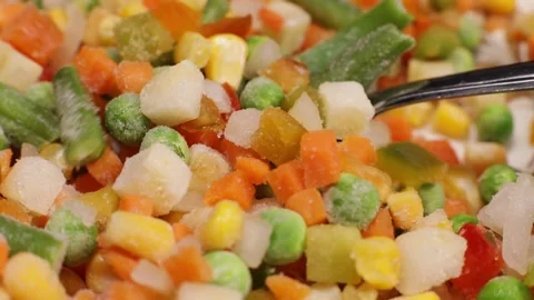 Spoon picks up mexican vegetable mix, healthy vegan food concept Stock Footage 230181608