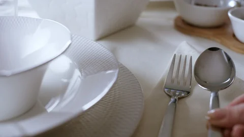 A spoon is placed near the fork at the dining table. Stock Footage 128454587