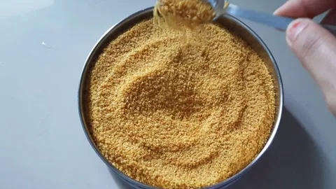 Spoon Pouring Mustard Dal Back into Bowl for Pickle Preparation Stock Footage 337938760