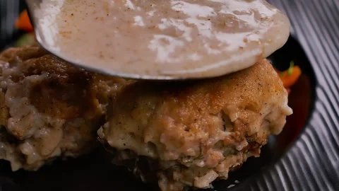 A spoon poursbechamel over meatball Stock-Footage 296132687