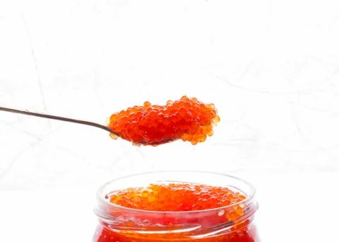 Spoon of red caviar for breakfast 스톡 사진