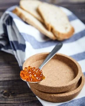 Spoon of red caviar Stock Photos