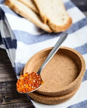 Spoon of red caviar Stock Photos