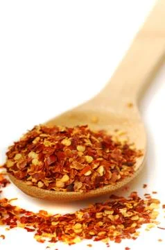 Spoon of red pepper flakes Stock Photos