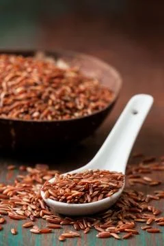 The spoon with red rice Stock Photos