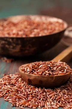 The spoon with red rice Stock Photos