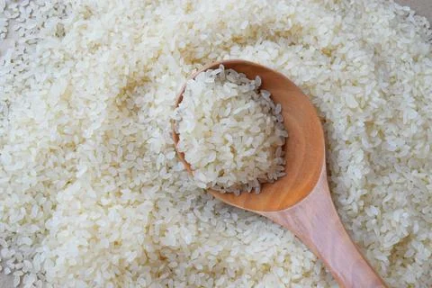 Spoon of rice Stock Photos