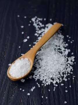 Spoon with salt Stock Photos