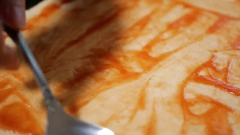 Spoon the sauce over the dough with a spoon Stock Footage 128667512