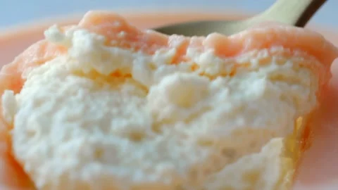 Spoon scooping and cutting delicious pink and white dessert Stock Footage 310521899