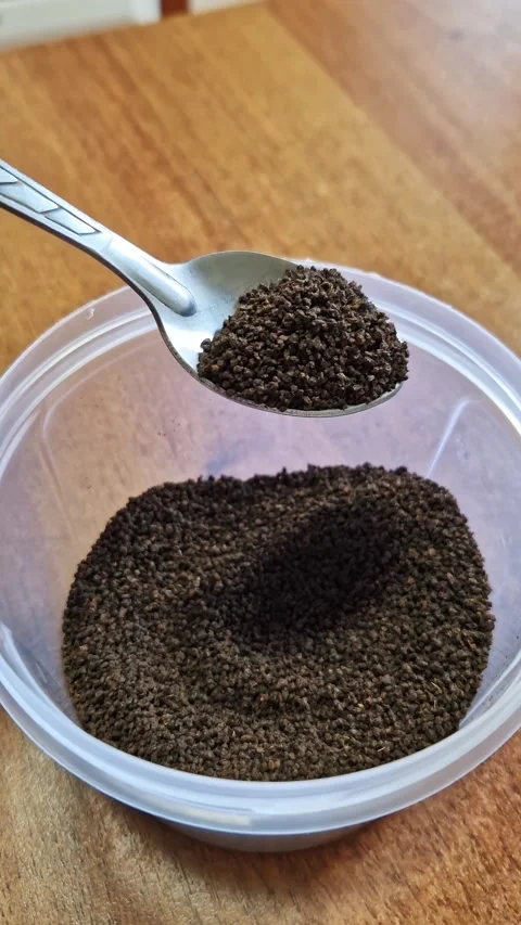 Spoon Scooping Dry Granulated Tea Leaves Macro Shot Stock Footage 321973262