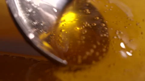 Spoon Scooping Honey Close-Up 1 Stock Footage 53024466