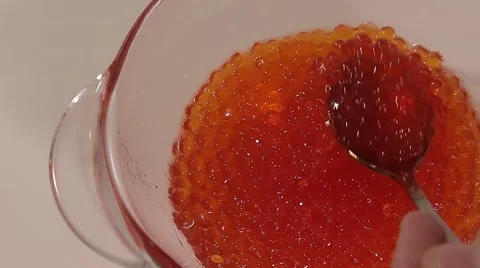 Spoon scoops caviar Video stock 68710587