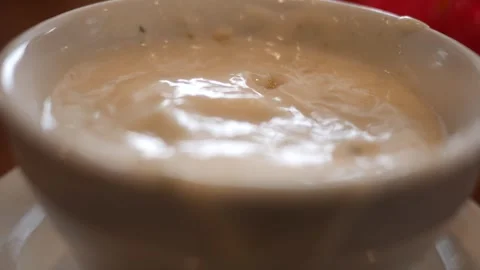 Spoon Scoops Clam Chowder or Potato Soup in Cup Stock Footage 325635424