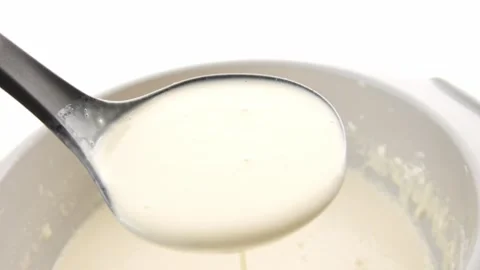 Spoon scoops pancake batter. Stock Footage 254522153