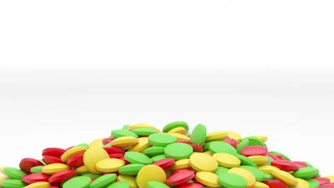 The spoon scoops up some vitamins of different colors and pours them back out Stock Footage 161755470