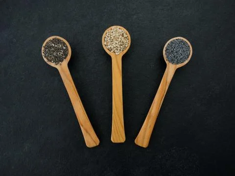 Spoon with seeds Stock Photos