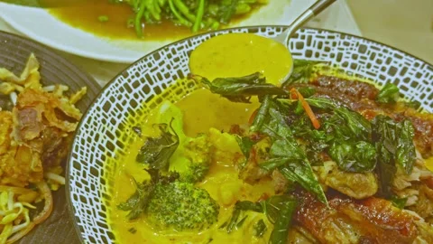Spoon Serving Thai Duck Curry with Vegetables Stock Footage 314984988
