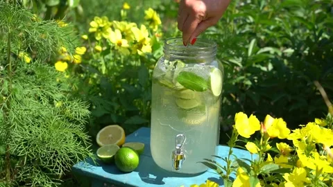 Spoon stir summer refreshing lemonade with fruit and berries Stock Footage 142457112