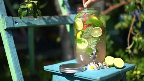 Spoon stir summer refreshing lemonade with fruit and berries Stock Footage 142457113